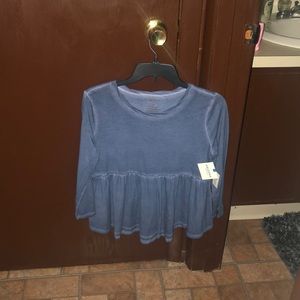 Baby doll peplum shirt. New with tags!! Great buy